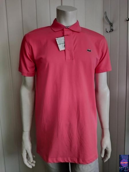 Поло коралового кольору застібка на гудзиках Lacoste 22 фото